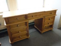 A pine twin pedestal dressing table,