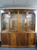 A good quality mahogany four door break front display cabinet,