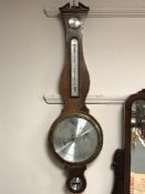A mahogany cased barometer with silvered dial by Comitti