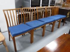 Five late 20th century teak dining chairs