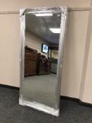 A rectangular silvered mirror,