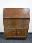 A mid twentieth century walnut bureau