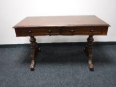 A Victorian mahogany library table