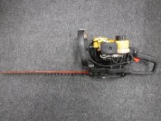 A Sabre HTS 53 petrol hedge trimmer and a Pro electric chain saw