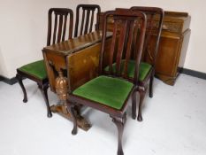 An early twentieth century carved oak sideboard together with matching drop leaf table and a set of