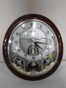 A contemporary small World Rhythm quartz wall clock