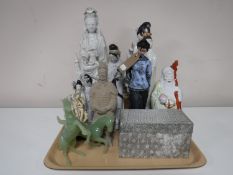 A tray containing Eastern figures, geishas, together with a pottery soldier, boxed Chinese vase,