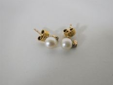 A pair of 14ct gold pearl and diamond earrings