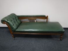 A late Victorian carved oak framed chaise longue,