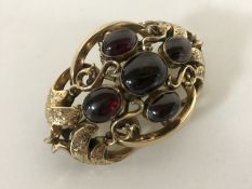 Large and impressive Victorian gold brooch set with cabochon garnets