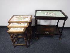 A nest of three oak tile topped table,