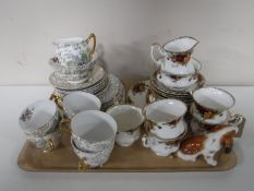 A tray containing a twenty one piece Royal Albert Old Country Roses tea set (one cup damaged)