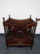 A reproduction mahogany Canterbury fitted a drawer