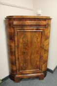 A nineteenth century mahogany corner cabinet,