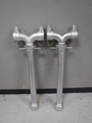 Two metal fire hydrant stands