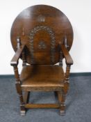 A carved oak monk's chair