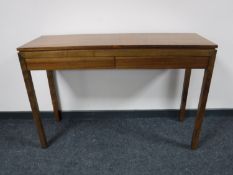 A Barker and Stonehouse two drawer side table in a walnut finish