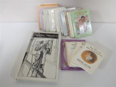 A small collection of Beatrix Potter children's books etc.