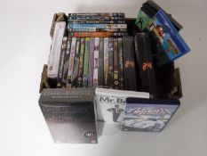 A box containing assorted DVD's and boxsets, Game of Thrones, 24 , Breaking Bad,