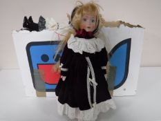 Two boxes containing assorted collectors dolls, gift sets, stationary sets,