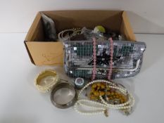 A box of costume jewellery - evening bag, bangles etc.