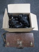 A box containing assorted camera cases