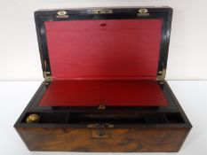 A Victorian walnut and brass bound writing box