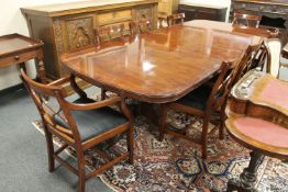 A good quality Regency style twin pedestal extending dining table, with two leaves, fully extended,