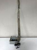 A tin containing two Mitchell fixed spool fishing reels with extra spools and two split cane fly