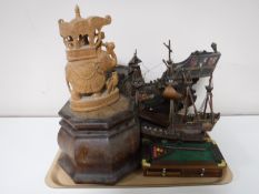 A tray containing a carved Indian hardwood figure, a Victorian wooden plinth,