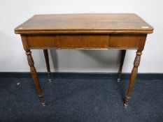 An antique mahogany TOT table fitted a drawer