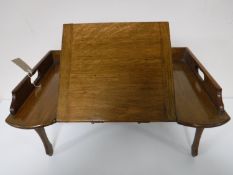A folding oak bed tray