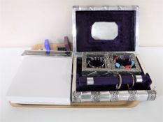 A tray of an eastern metal jewellery box in the form of two books,