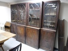 A Victorian mahogany four-door break-front bookcase,