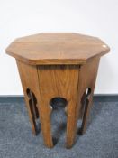 An octagonal oak Arts and Crafts occasional table