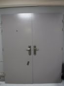 A pair of steel security doors with key and frame