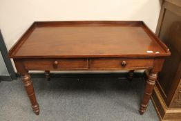 A Victorian mahogany writing desk, fitted drawer,