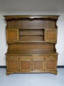 A Stag four door kitchen dresser in an oak finish