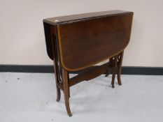 A Victorian inlaid mahogany Sutherland table