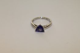 A platinum triangular cut tanzanite ring, size K.