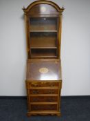 An inlaid yew wood Victorian style bureau bookcase