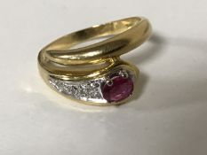 An 18ct gold ruby and diamond snake ring, 4.