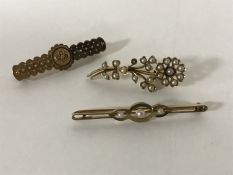 Three 15ct gold brooches, two set with pearls, 8.