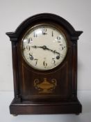 A Victorian inlaid mahogany inlaid mantel clock