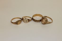 A group of four 9ct gold rings
