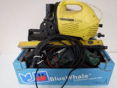 A box containing assorted power tools, two spirit levels,