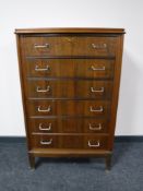 A mid twentieth century walnut six drawer chest