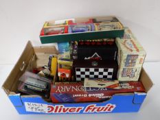 A box containing assorted board games, Wallace and Gromit playhouse,