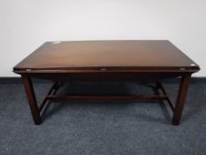 A mahogany flap sided coffee table