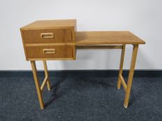 A mid twentieth century Danish teak telephone table fitted two drawers